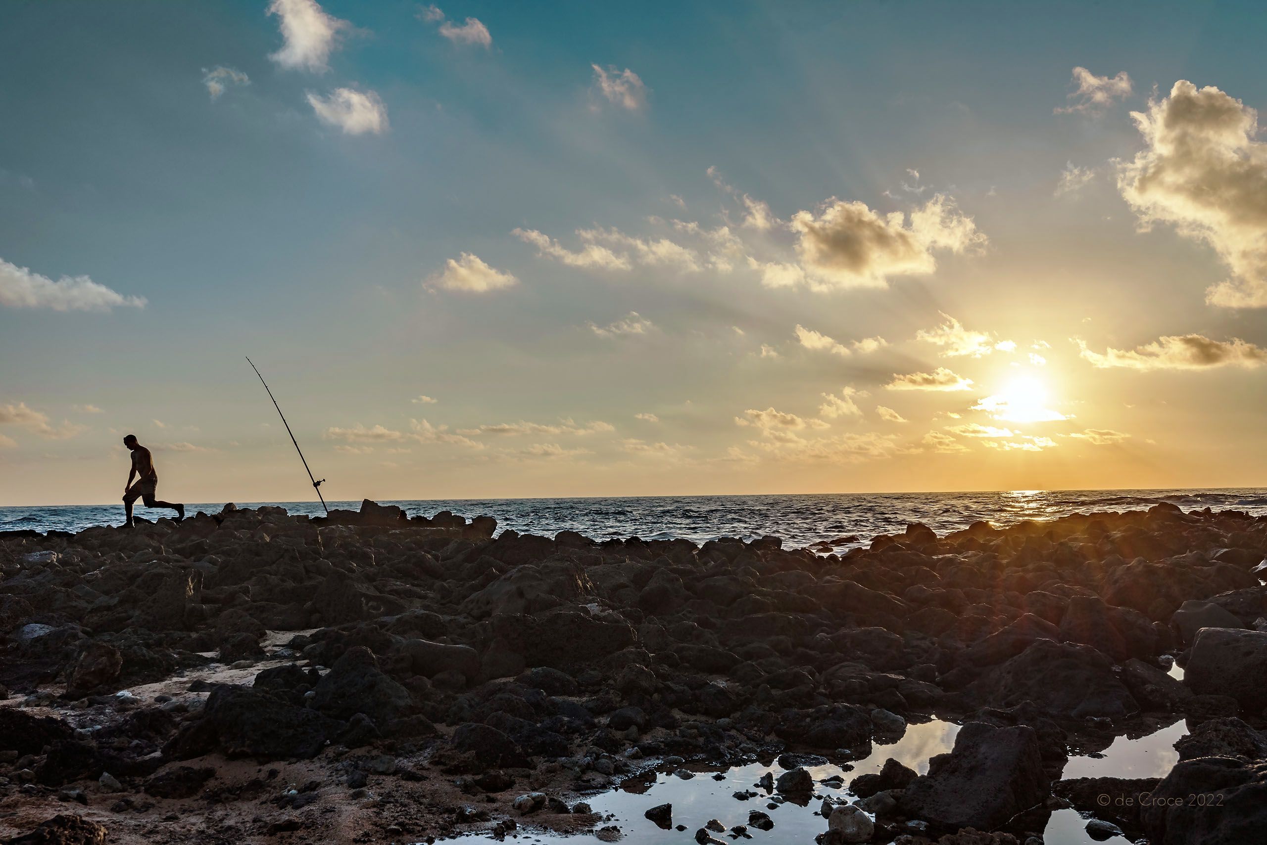 Fisher On Lava Rock - Hawaii