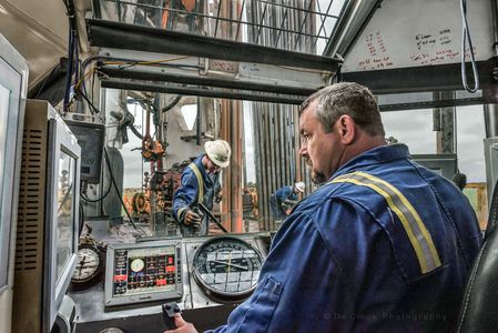 Commercial editorial photography featuring industrial worker at drill site. Industrial Commercial photography