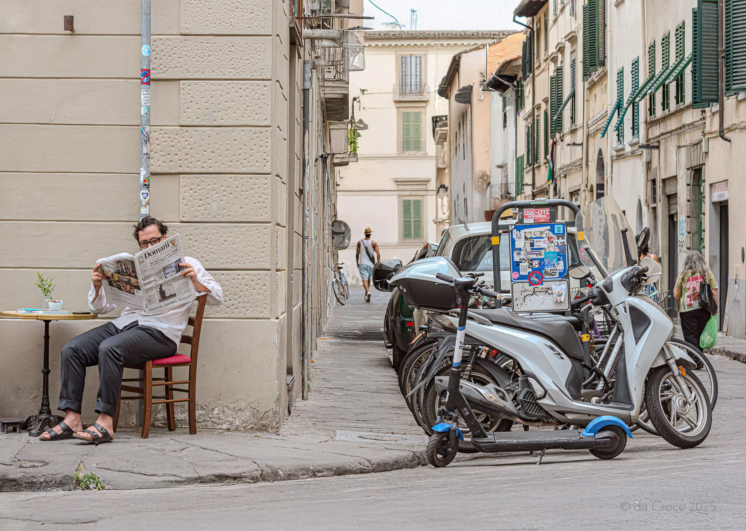 Travel photography on Italian street depicts man reading newspaper at tiny outdoor cafe in Florence Italy Italy Street Life - Man & Newspaper Firenze Tuscany