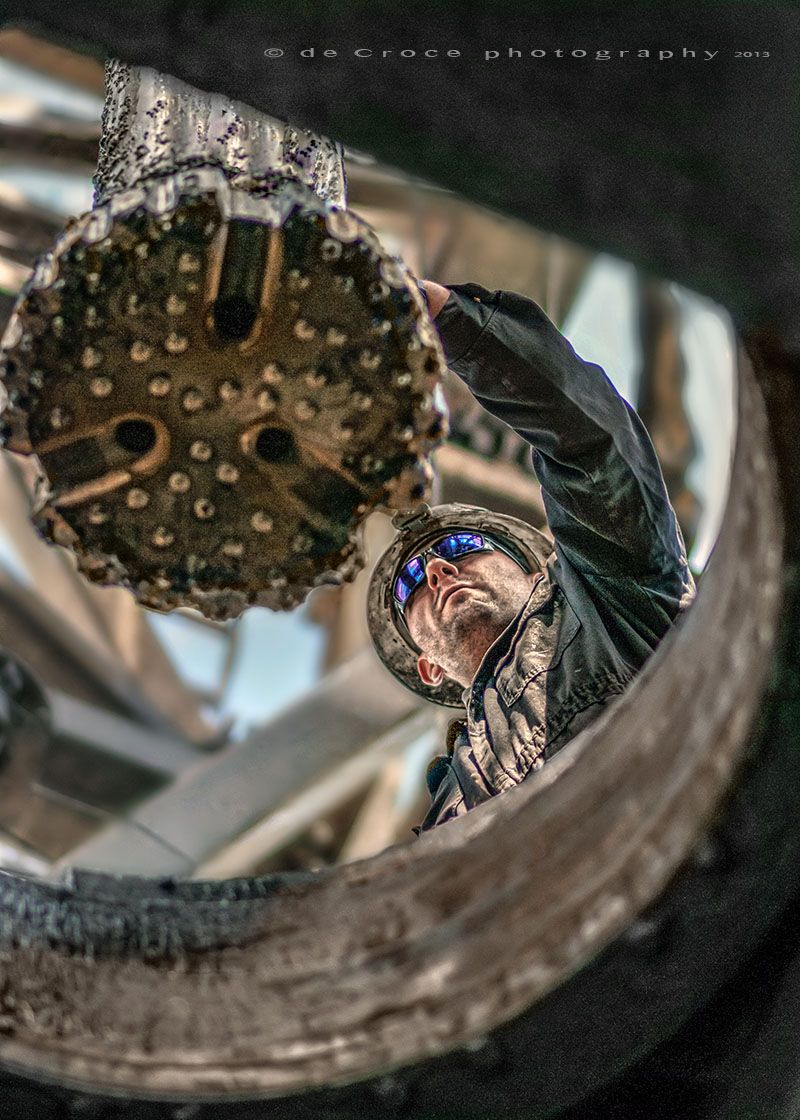 Energy photographers in Colorado capture action photography for WPX Energy of roughneck and giant drill bit. Roughneck & Drill-Bit