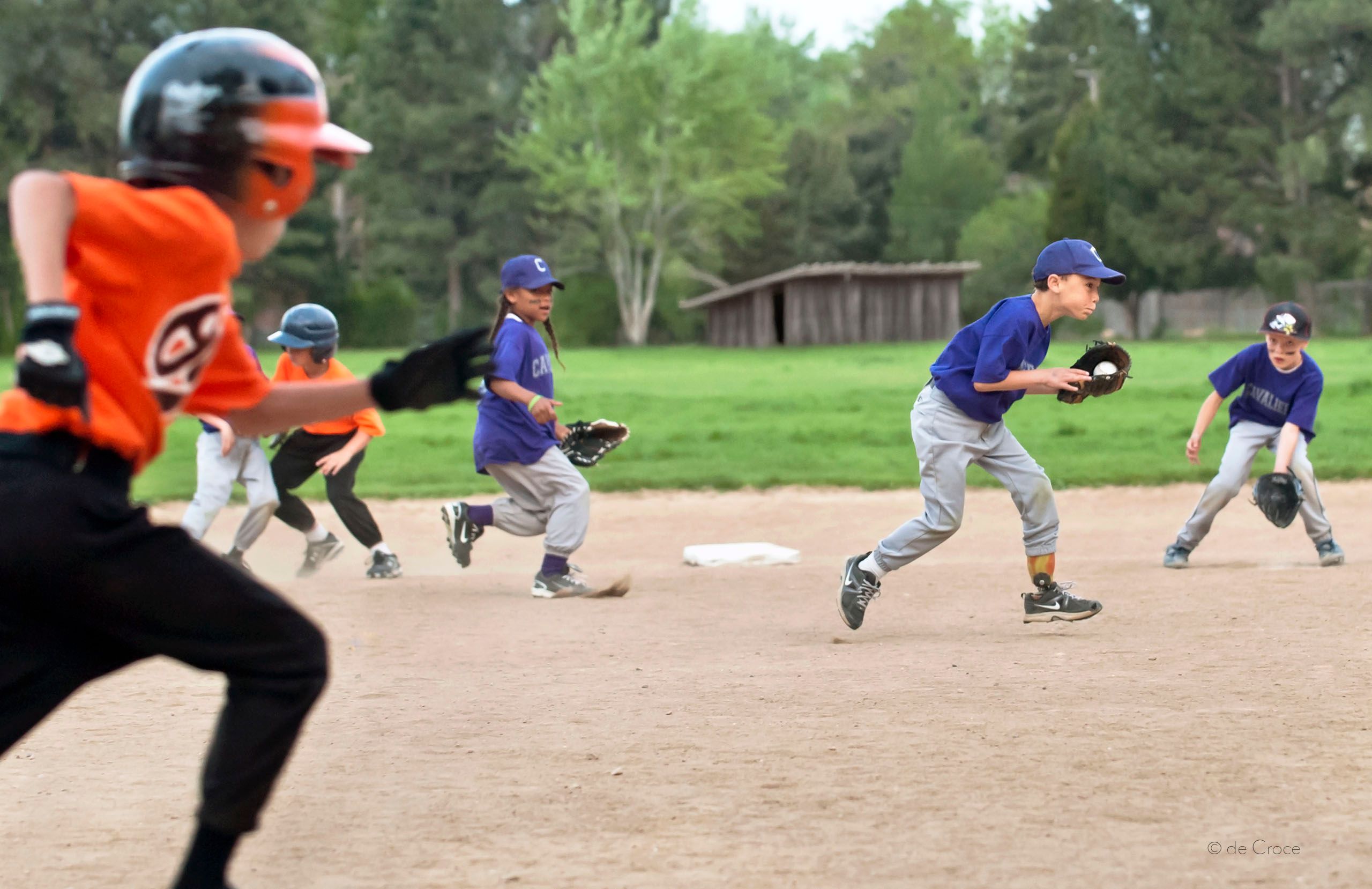 Action everywhere in this commercial lifestyle illustraion Little League Baseball - Lifestyle Photography