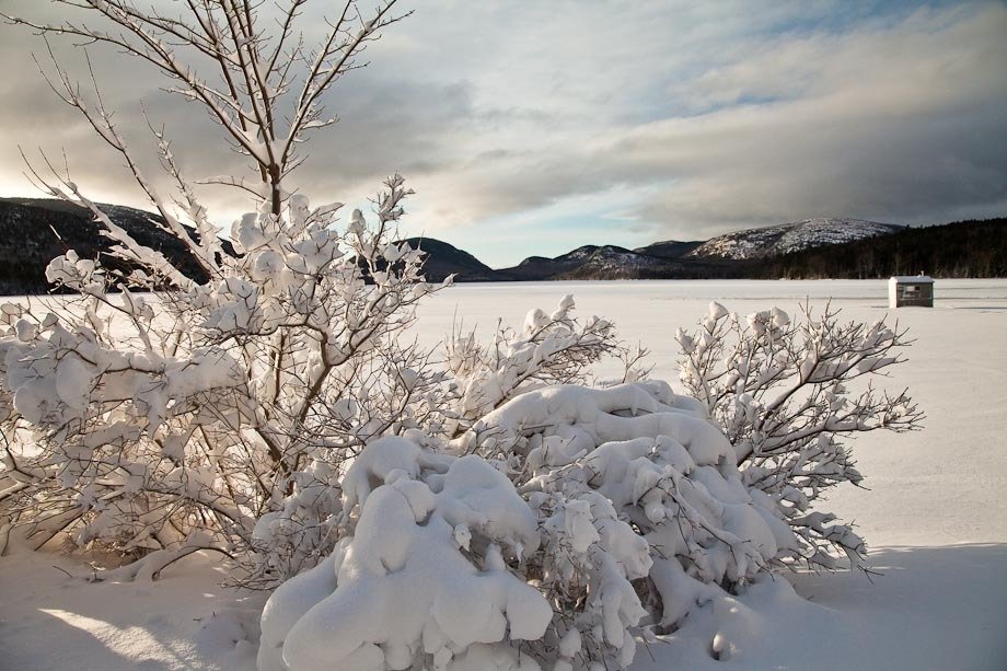Ice fishing shack at sunrise at Eagle Lake in Acadia National Park.