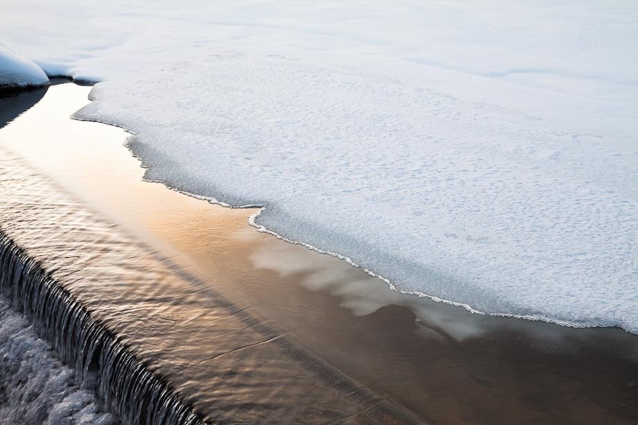 The edge of the ice near a small dam  on Eagle Lake in Acadia National Park