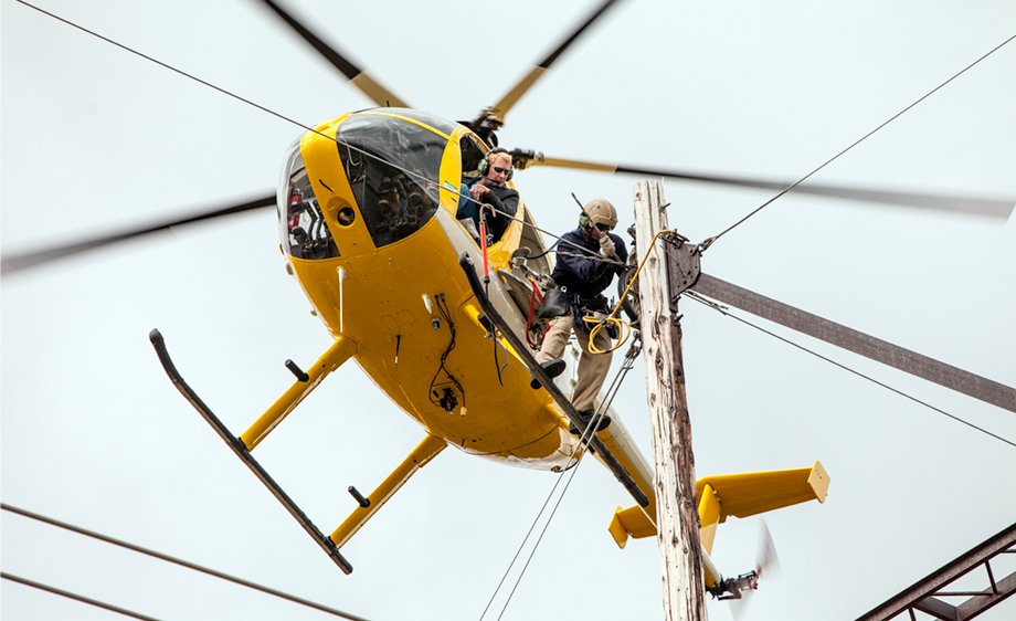 Linemen in a helicopter
