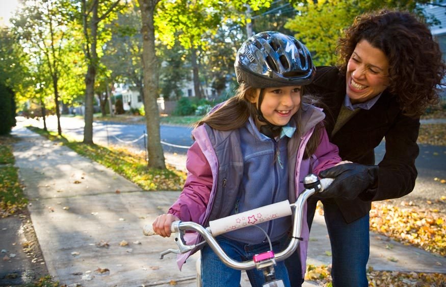 Mother & daughter with bicycle