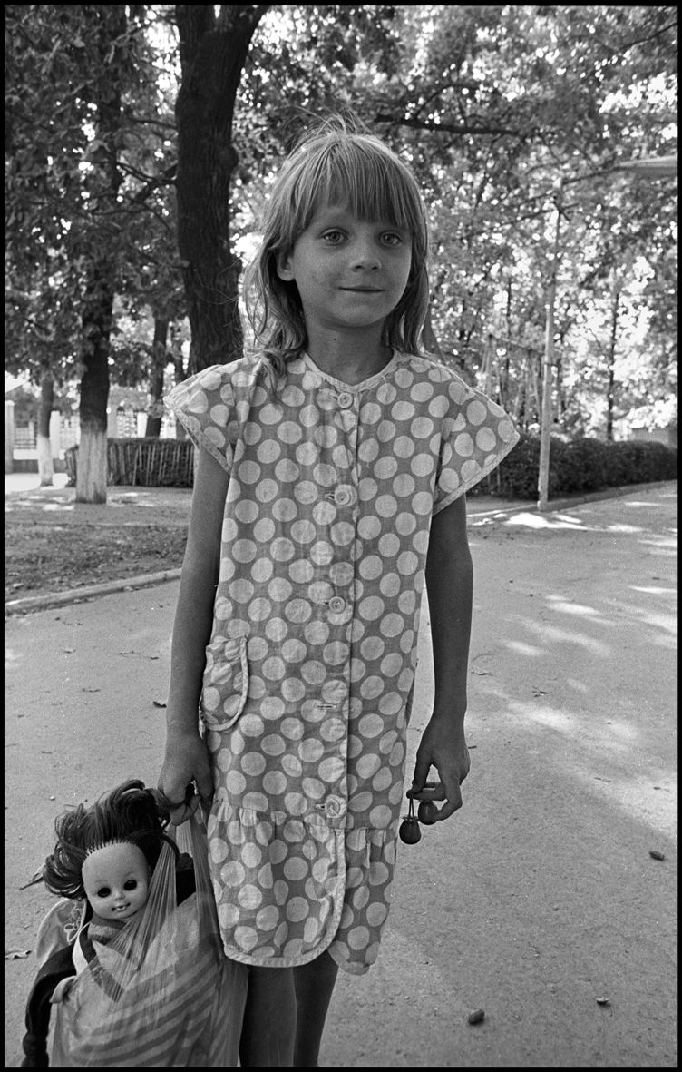 1girl_walking_with_her_doll_chimkent_1995_f_k88_p23