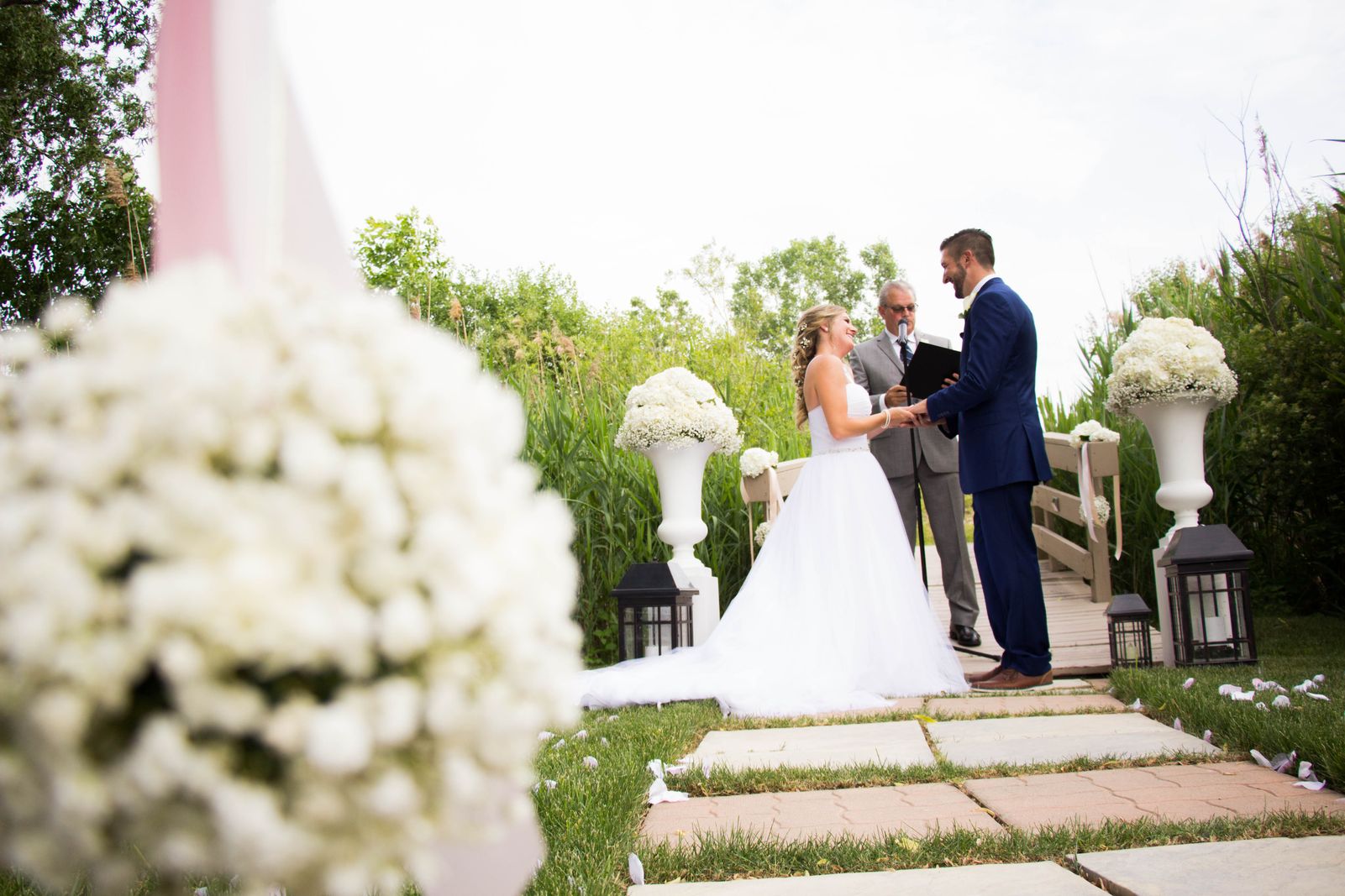 Wedding, ceremony, flowers, altars, aisles, stone urns, lanterns, romantic, rustic, outdoor, backyard, pomanders, kissing balls Ceremony Flowers