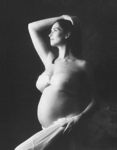 pregnant woman with arm raised