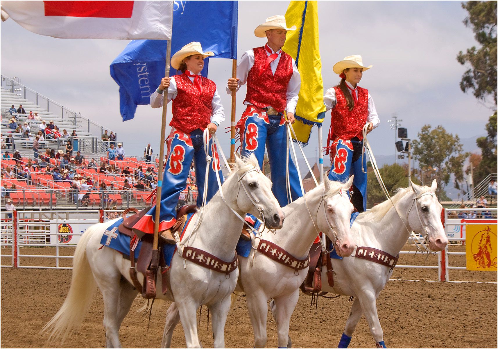1standing_on_horses_with_flags.jpg