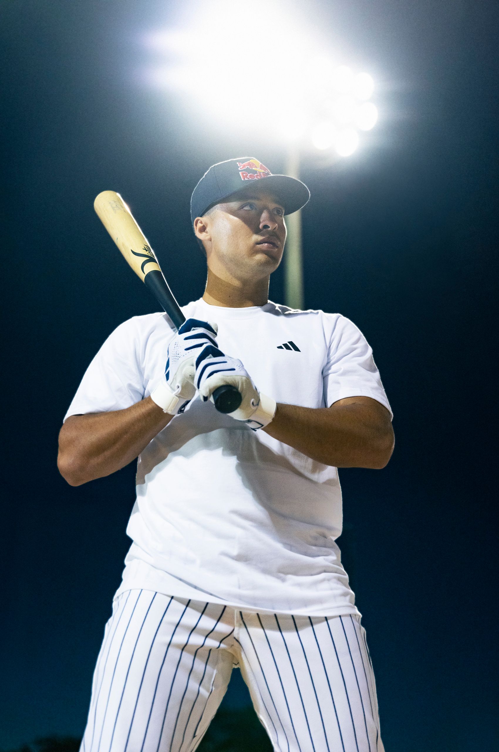 Warms up in the batters box Anthony Volpe