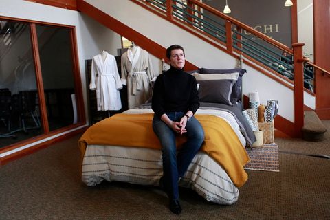 Karyn Barsa, CEO of Berkeley's Coyuchi, sits on their 'test bed' in their office displaying linens, in Berkeley, California on  April 11, 2012. coyuchi14_1447_js.jpg
