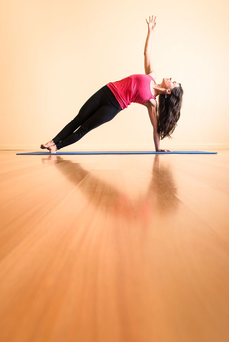 Young Woman Practicing Yoga in Studio