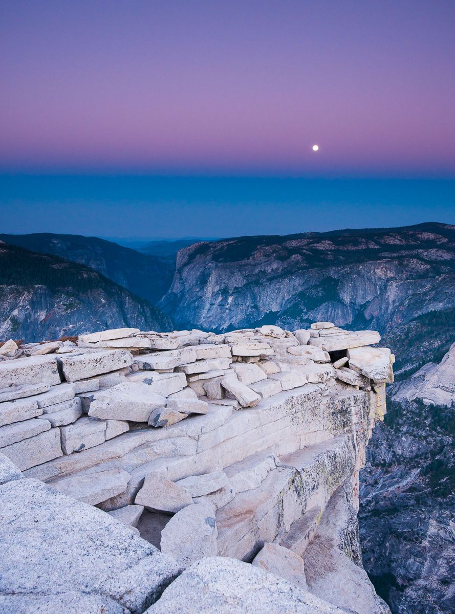 Yosemite National Park, California Full Moon Setting over Yosemity Valley from the Summit "Diving Board" of Half Dome
