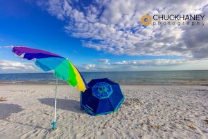 Umbrellas on an empty beach on Sanibel Island, Florida, USA beach umbrellas