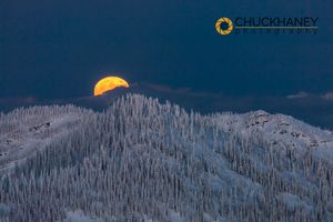 Full moon rises over snowy mountains from the summit of Big Mountain at Whitefish, Montana, USA Big-Mtn-Moonrise_041-copy.jpg