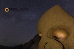 Skull Rock lit up at night in Joshua Tree National Park, California, USA Joshua Tree National Park