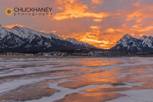 Brilliant sunrise reflects on winter ice of Abraham Lake near Nordegg, Alberta, Canada Abraham-Lk-Sunrise_002-445.jpg