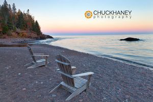 Adirondack chairs on the shores of Lake superior at Lutsen Resort, Minnesota, USA Lutsen Resort