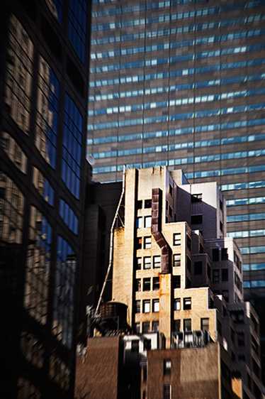 Pre-WWII Building dominated by modern office towers. East 57th Street, New York City 2008