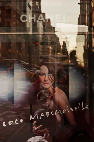 A bus shelter advertisement reflecting a prime midtowm NYC marketplace. 2008 Coco 57th Street, New York City