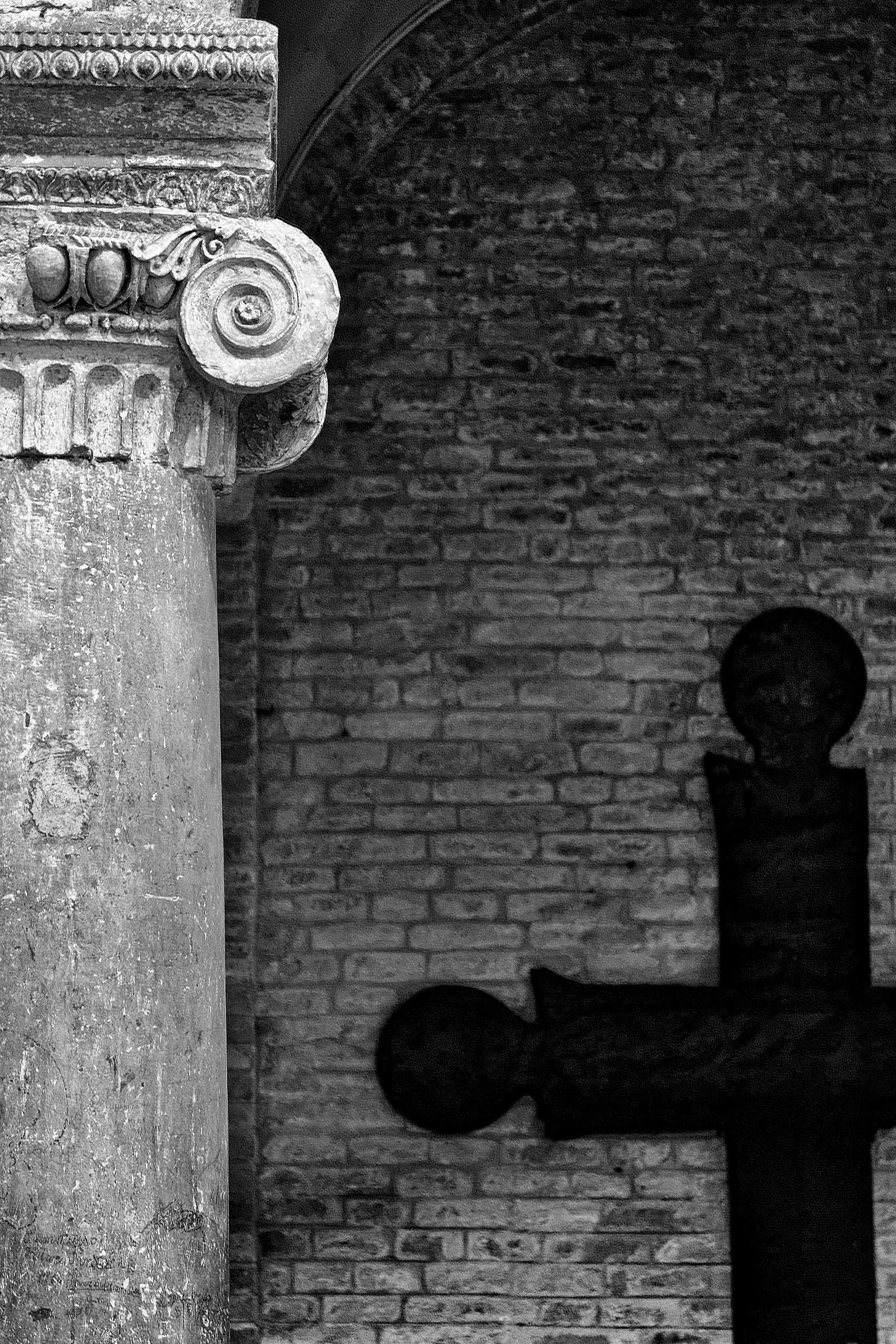 The Cross of Saint Agila from the 6th century and an 11th century Medieval Column in the Church of Saints Vitale and Agricola. Column and Cross