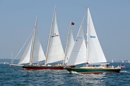 Sailboats racing before the start of the Gloucester Schooner Festival