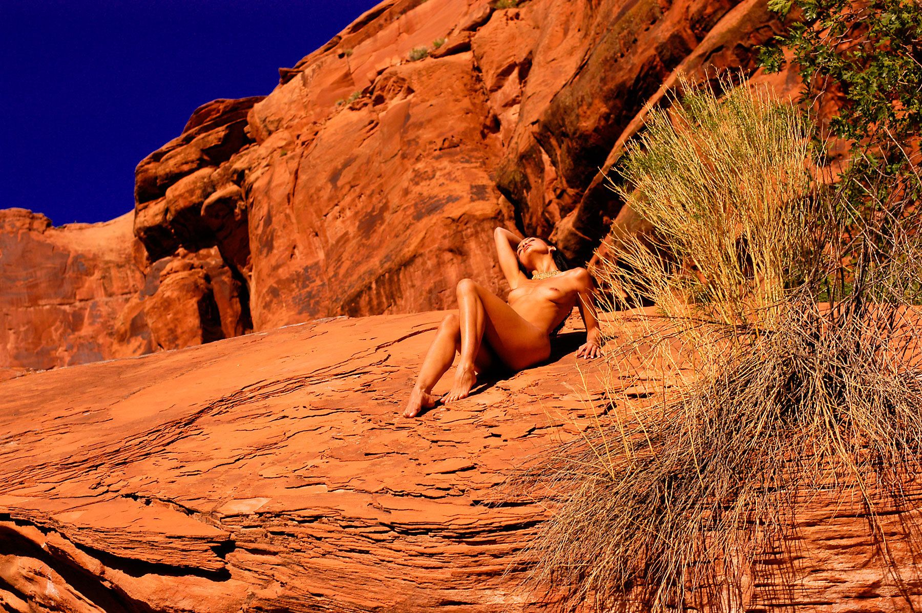 Nude Woman Stretched Out In A Desert Wash