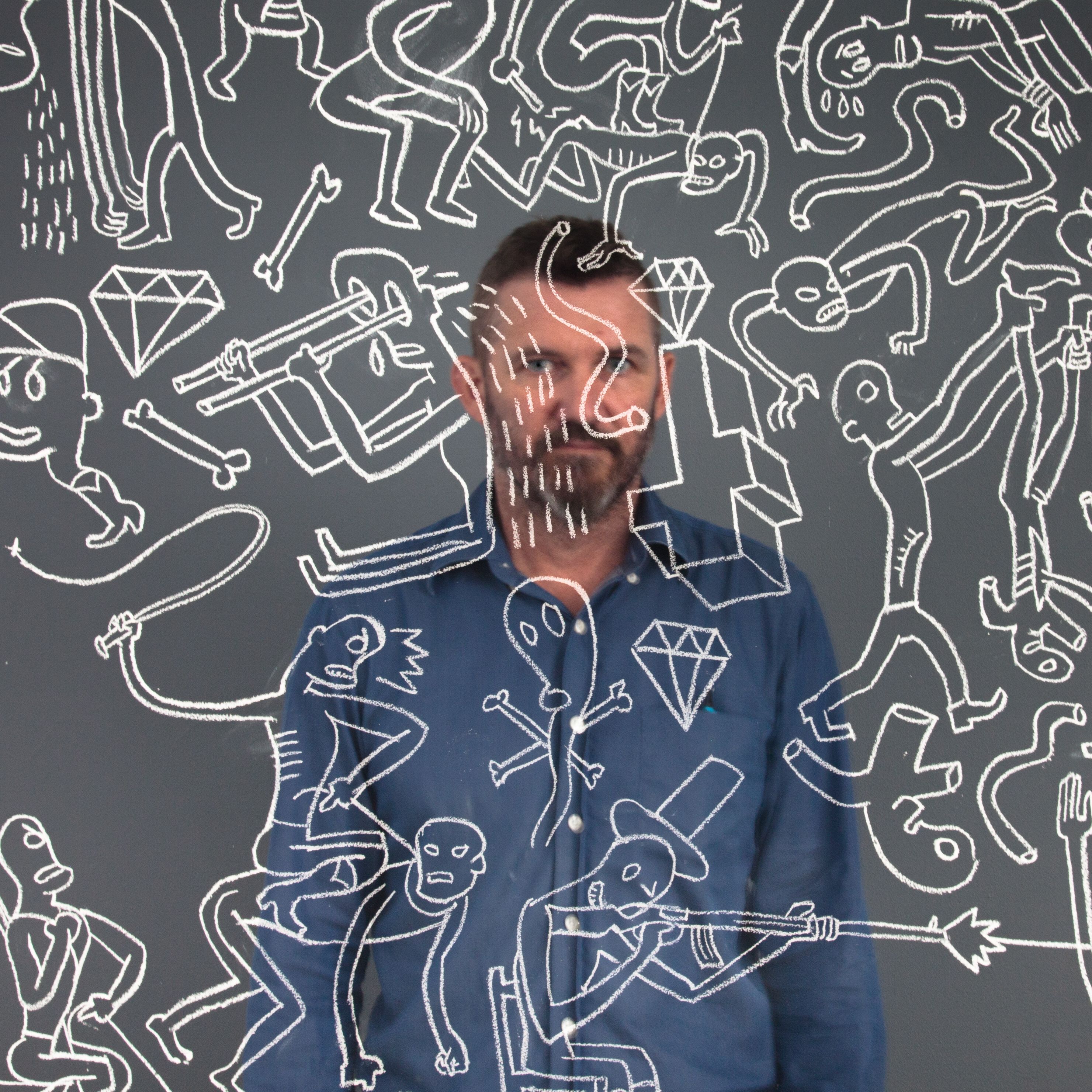 Conrad Botes with an untitled wall drawing