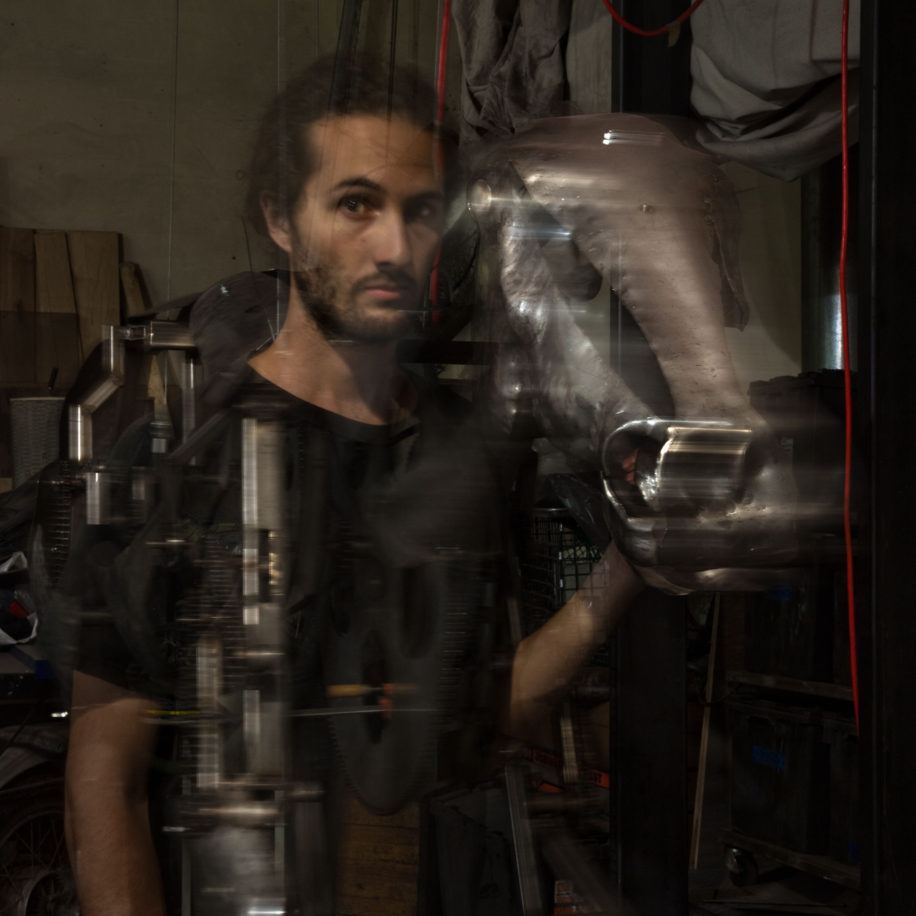 Adrian Landon with the sculpture "Mechanical Horse"