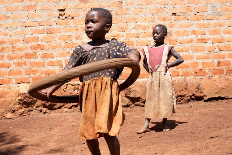 Patience, 4 years plays with a tyre. Masindi District, Uganda. 1uganda_education_children_19.jpg