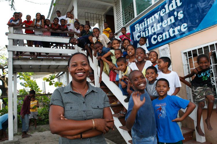 Rumsfeldt Child Care Centre in the Riverdam community. Pam, EveryChild Staff councillor, Photographed with Children who attend the centre and receive a free evening meal and access to toys and adults to listen to their problems and thoughts. 1guyana_child_abuse_20.jpg