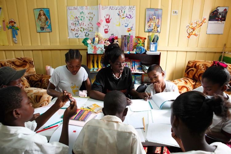 Michelle Anderson, EveryChild 'Child Care Counsellor' running a child care group session for young people to express through drawing and writing their feelings of anger, sadness, happiness. georgetown, Guyana. 1child_abuse_guyana_5.jpg