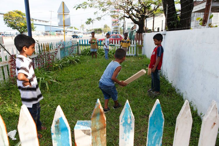 Boys play cricket. Rumsfeldt Child Care Centre in the Riverdam community. Children who attend the centre receive a free evening meal and access to toys and adults to listen to their problems and thoughts. Georgetown, Guyana. 1cricket_guyana.jpg