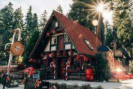 Sun shining through the trees over Santa's House at Skypark SKYPARK in Lake Arrowhead