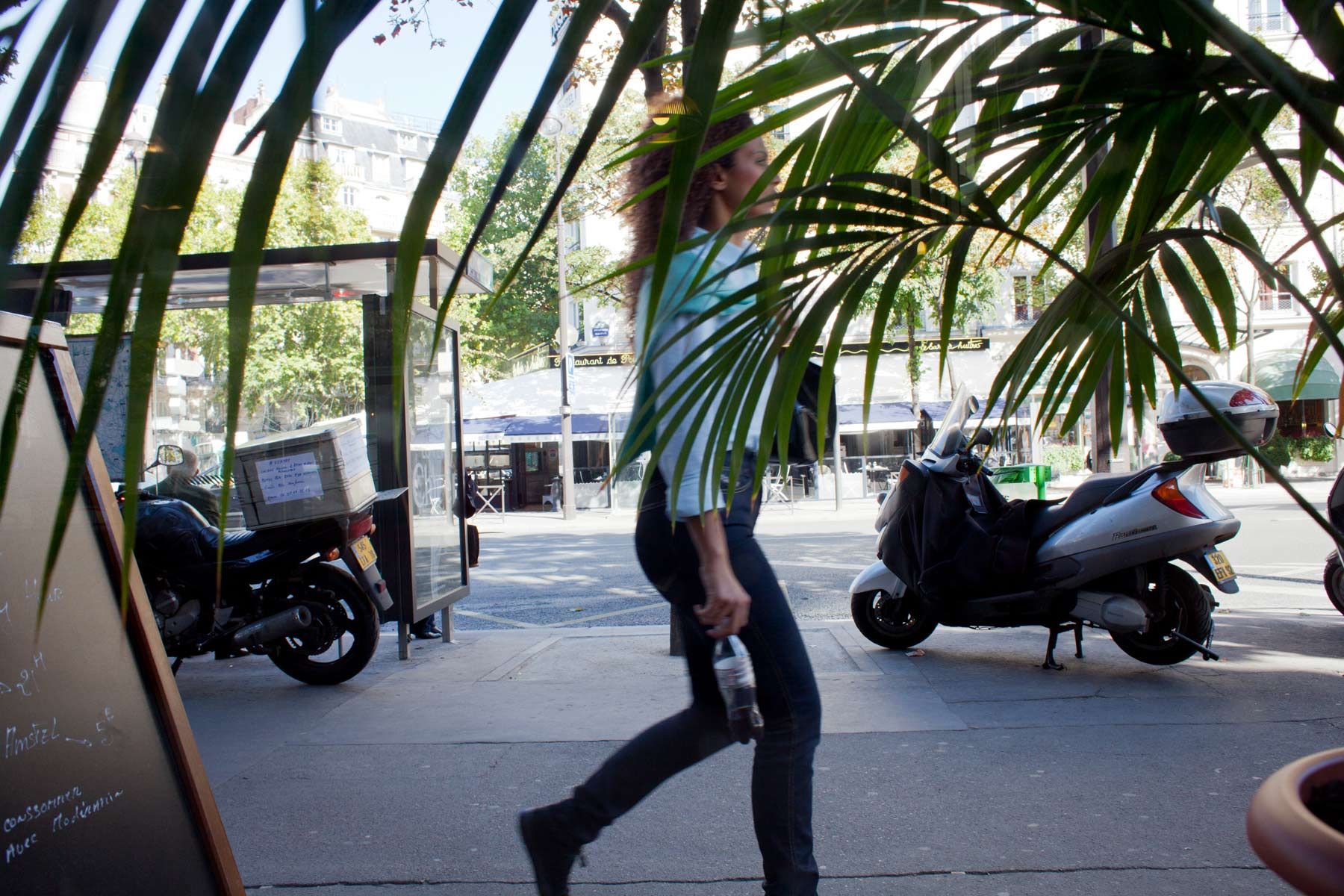 Paris-woman-walking-through-palm-leaves.jpg
