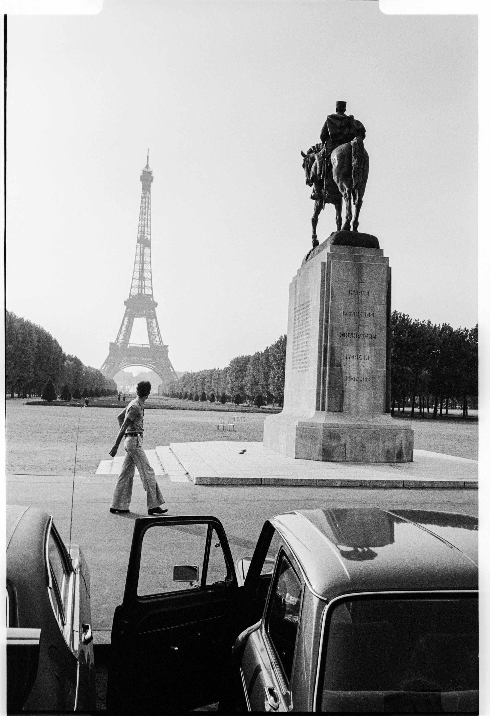 Man walking past Eiffel Tower France 1976.jpg