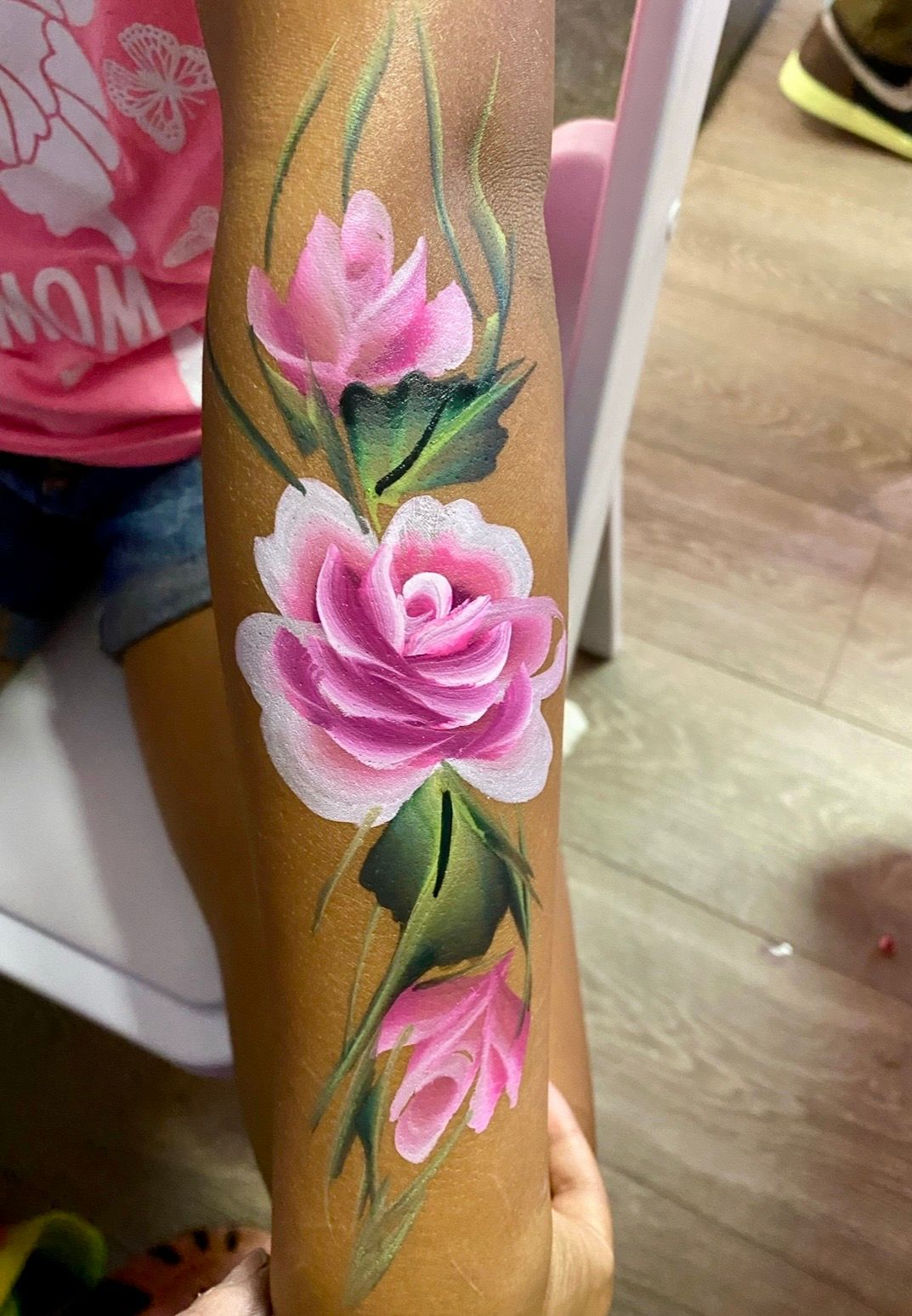 Rose on arm face painter