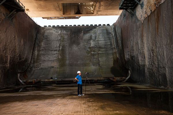 Michael Soluri photographing in Apollo era flame trench Cave Art Contiuum