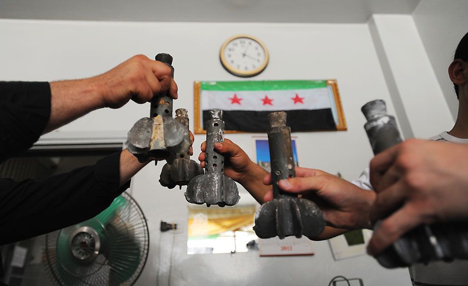 Syrian rebel fighters in Aleppo prepare to fight.