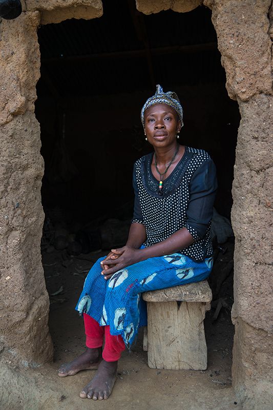 Woman in a mud house