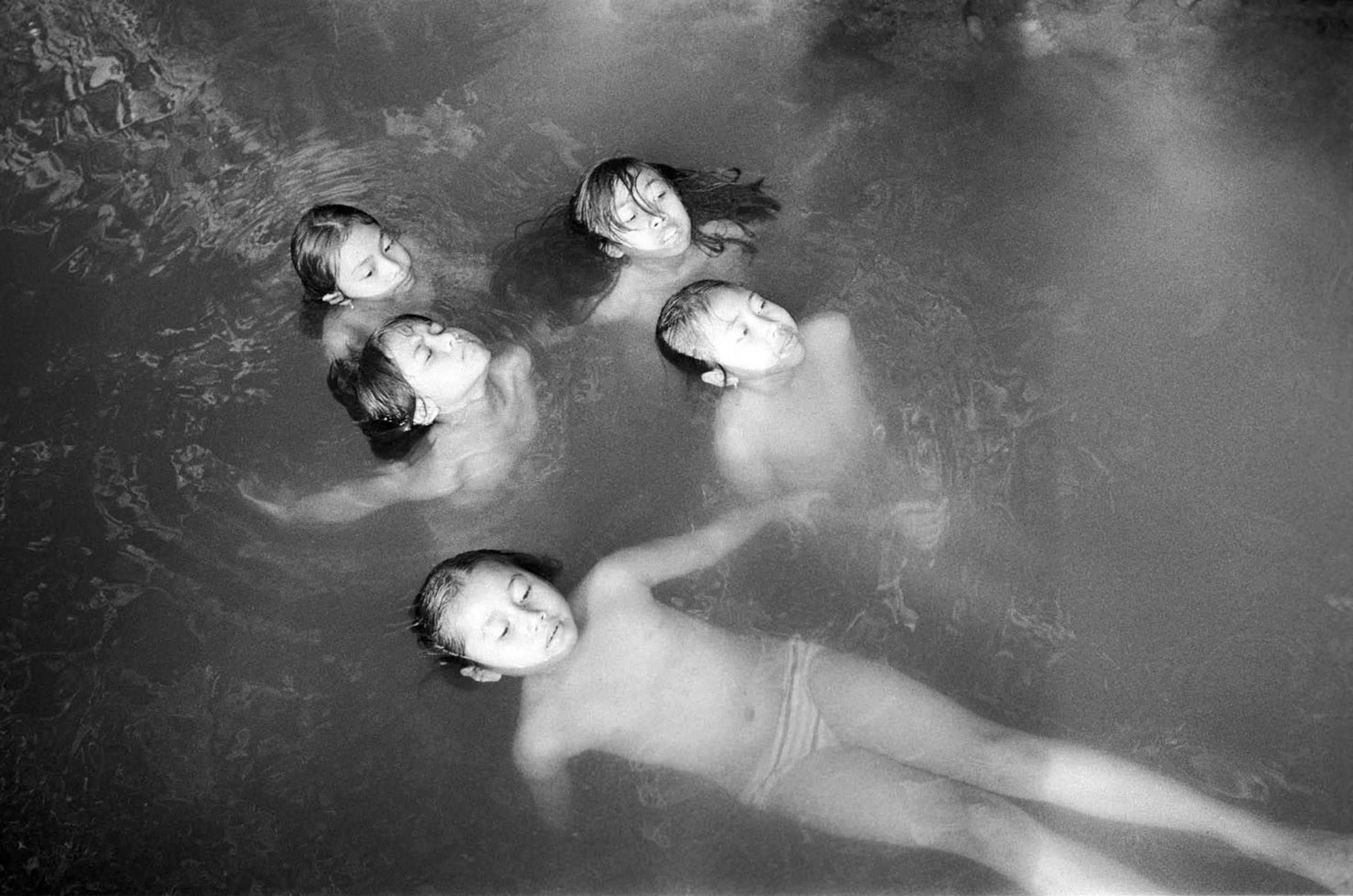 Girls playing in the river