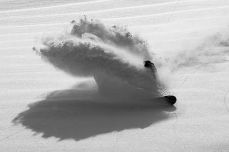 Kelly Clark. Baldface, BC backcountry powder slash. Snowboarder Slashes in Pristine Powder