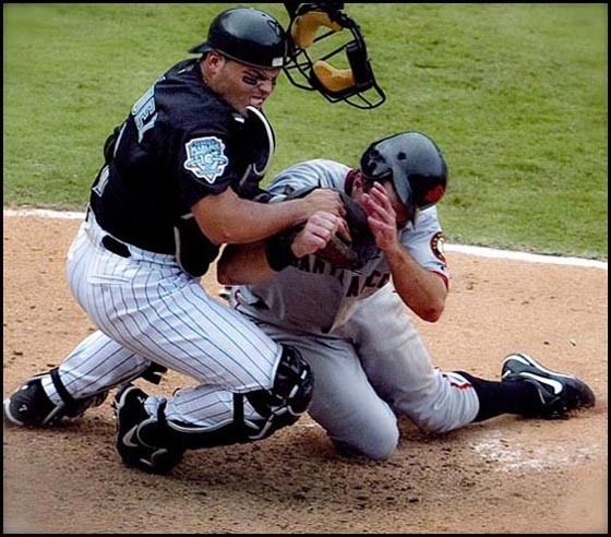 Florida Marlins Pudge Rodriguez tags out San Francisco Giants' J.T. Snow