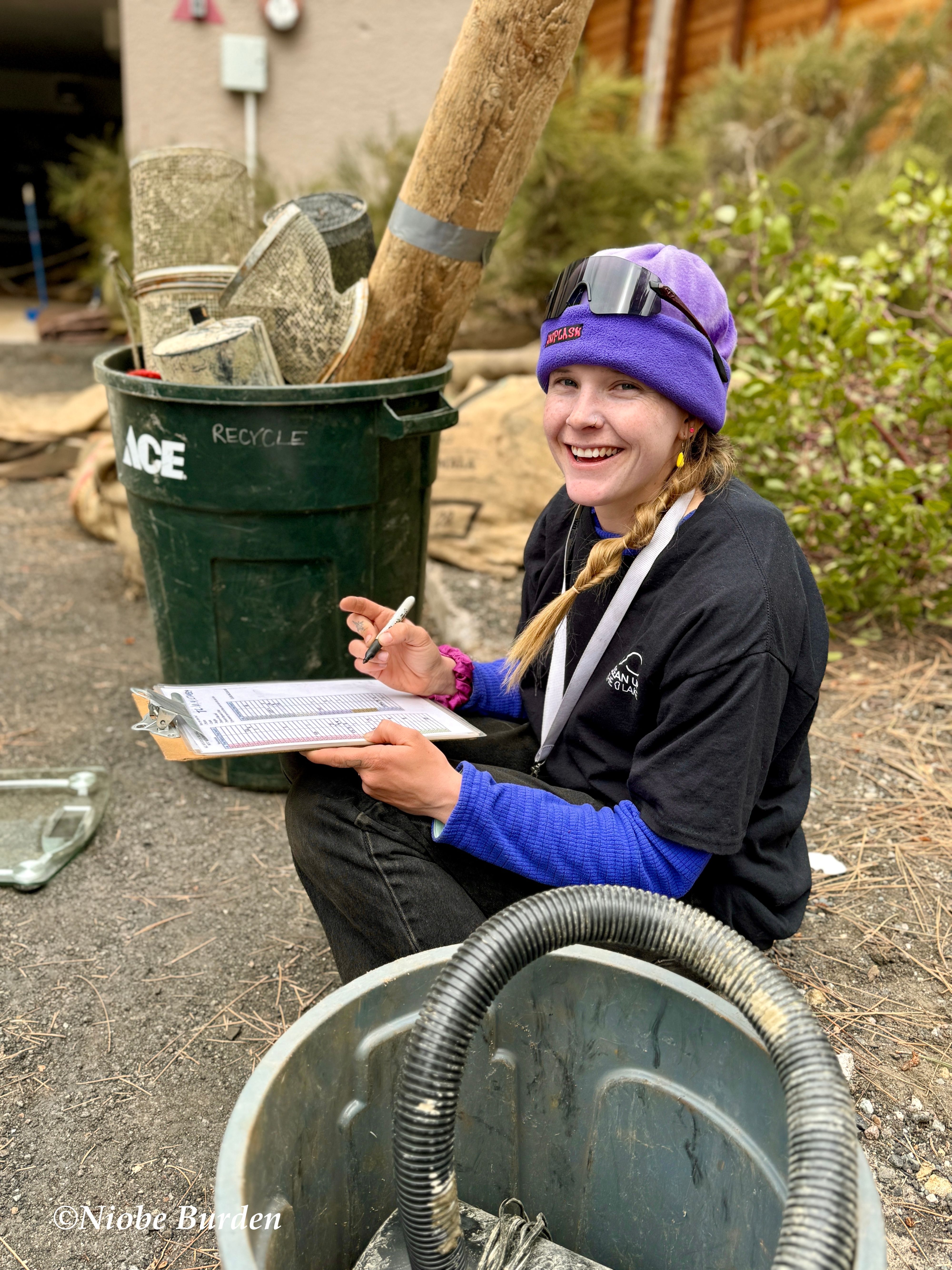 Girl with clipboard writing down stats