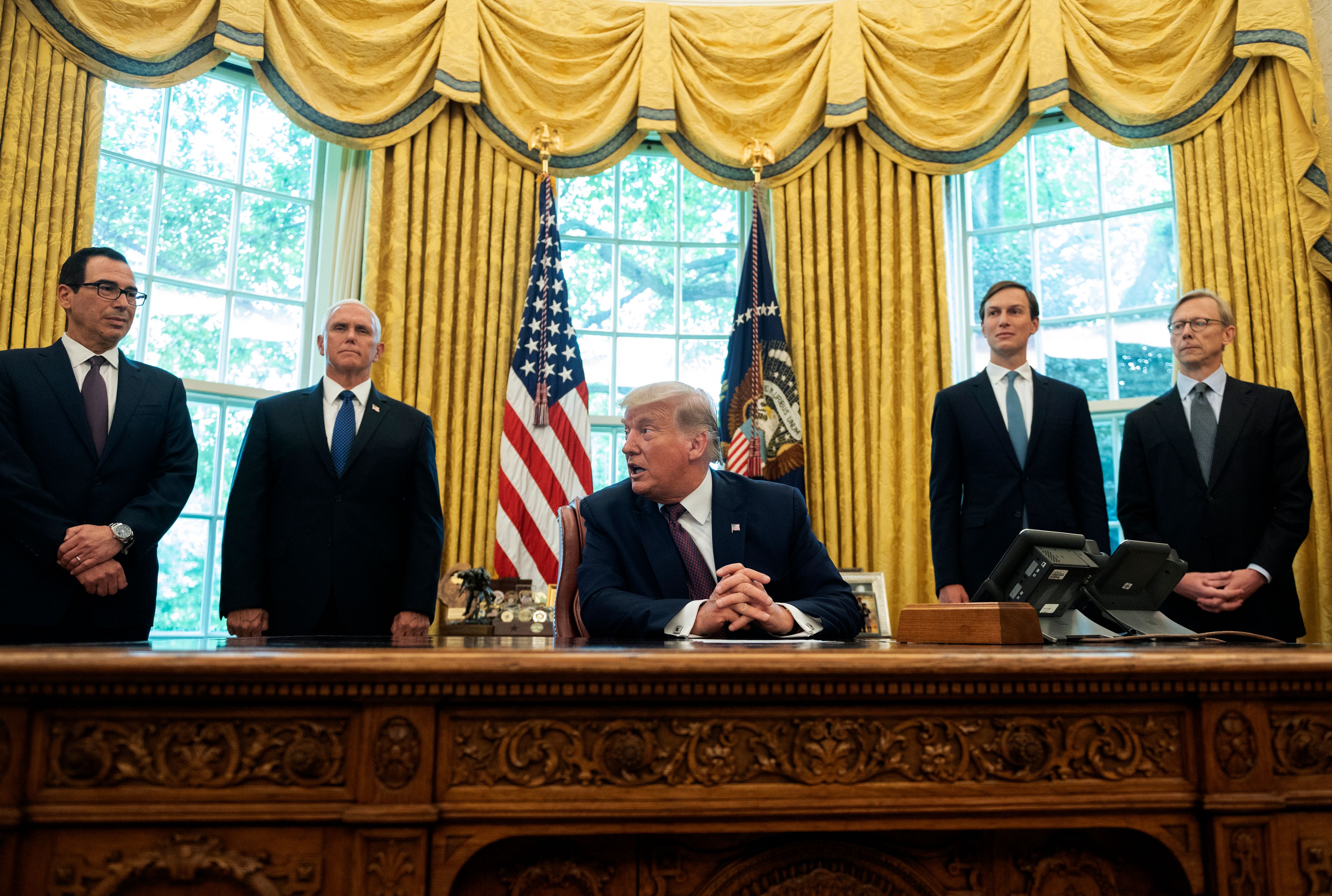 US President Donald Trump is joined by (L-R) US Secretary of the Treasury Steven Mnuchin, US Vice President Mike Pence, Senior Advisor to the President Jared Kushner and US special representative for Iran, Brian Hook, in the Oval Office of the White House in Washington, DC. 8PR8UM.jpg
