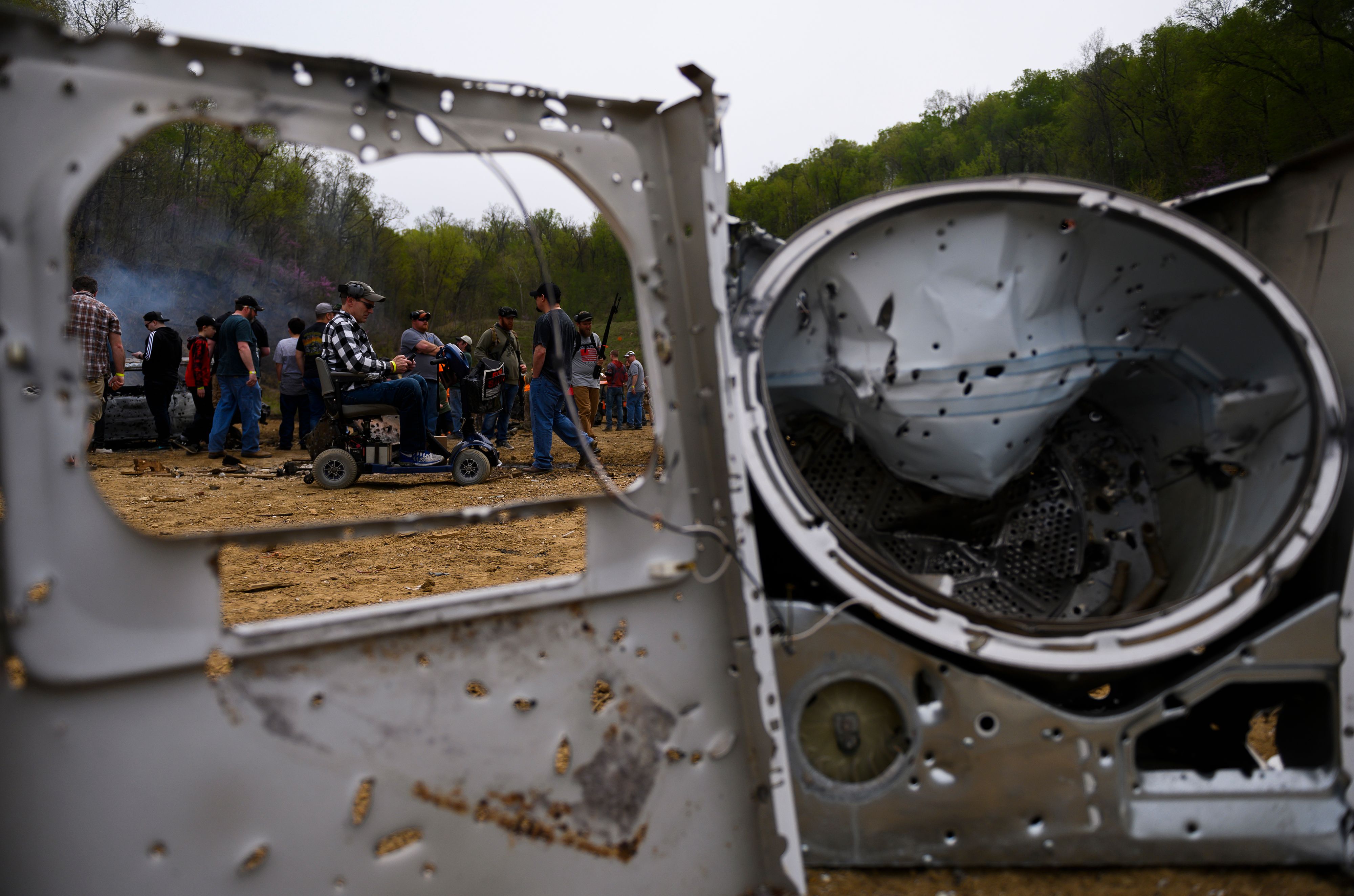 Visitors explore destruction on the main firing line during a break in the shooting at the Knob Creek Machine Gun Shoot and Military Gun show. 1FM8D5.jpg