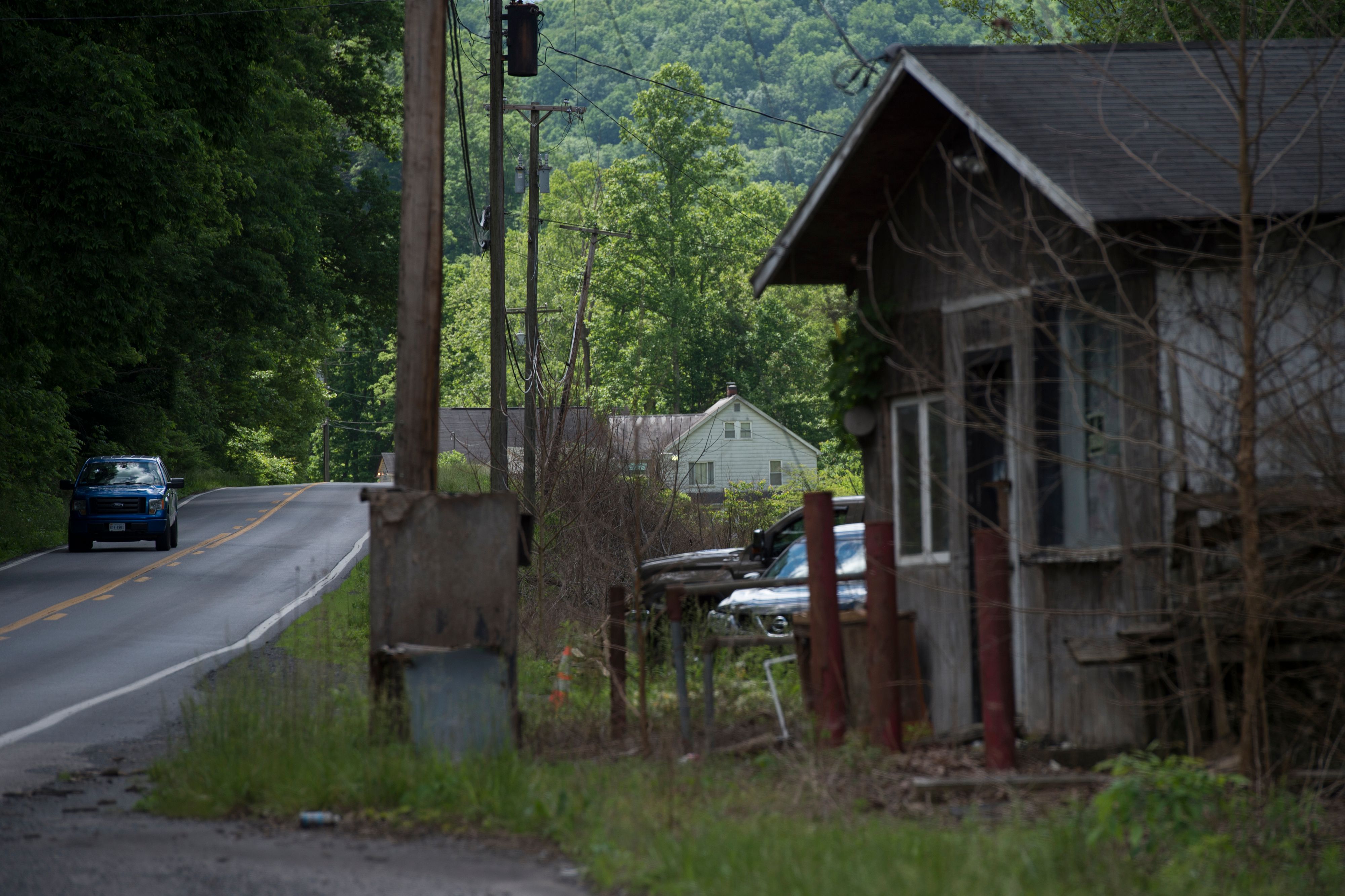 The House of the Lord Jesus church, a Pentecostal serpent handlers church, is seen in the distance in Squire. MN4_9579 copy.jpg