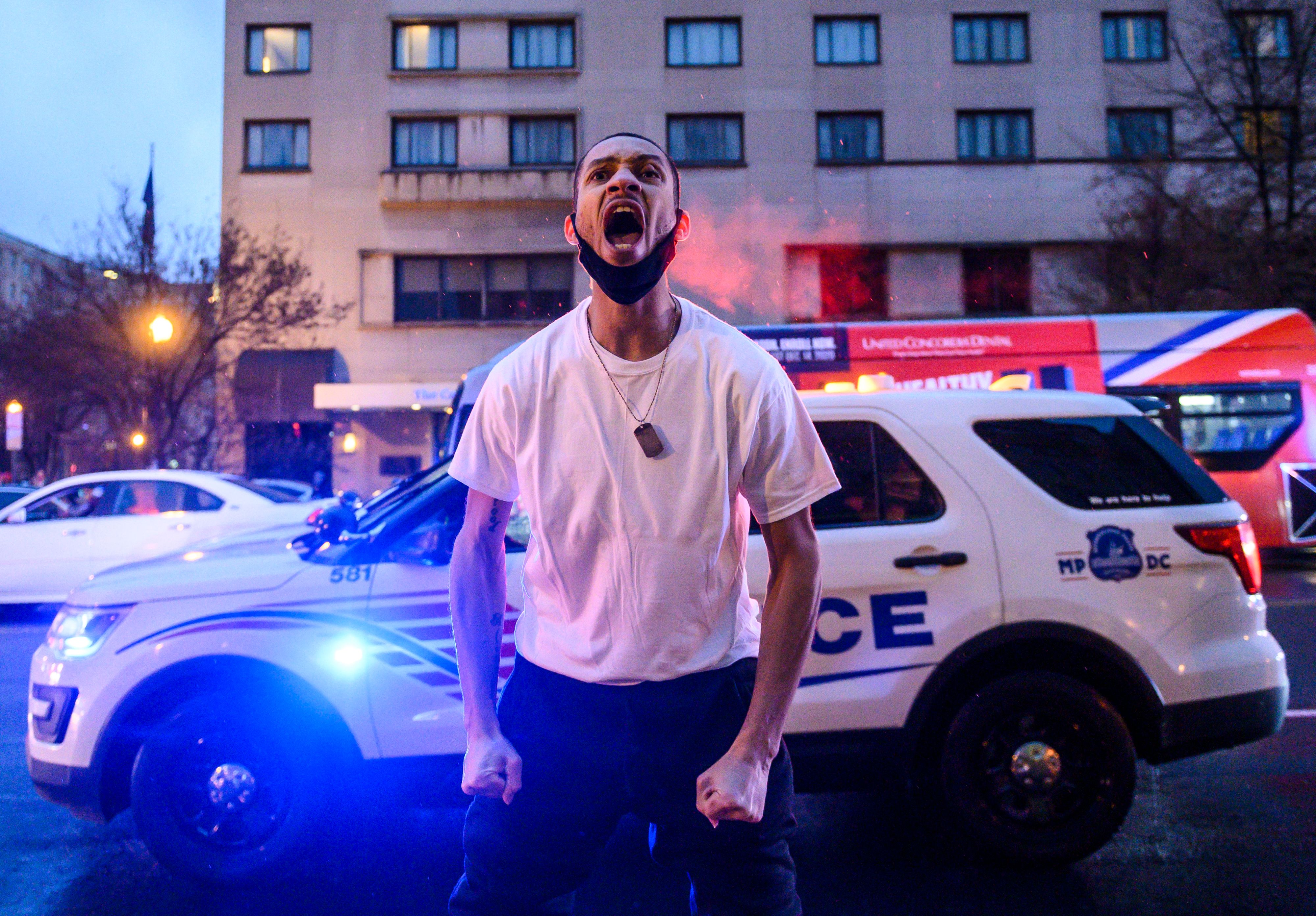A Black Lives Matter activist screams at pro-Trump supporters during a confrontation near Black Lives Matter plaza in Washington, DC. 8Y88P9.jpg