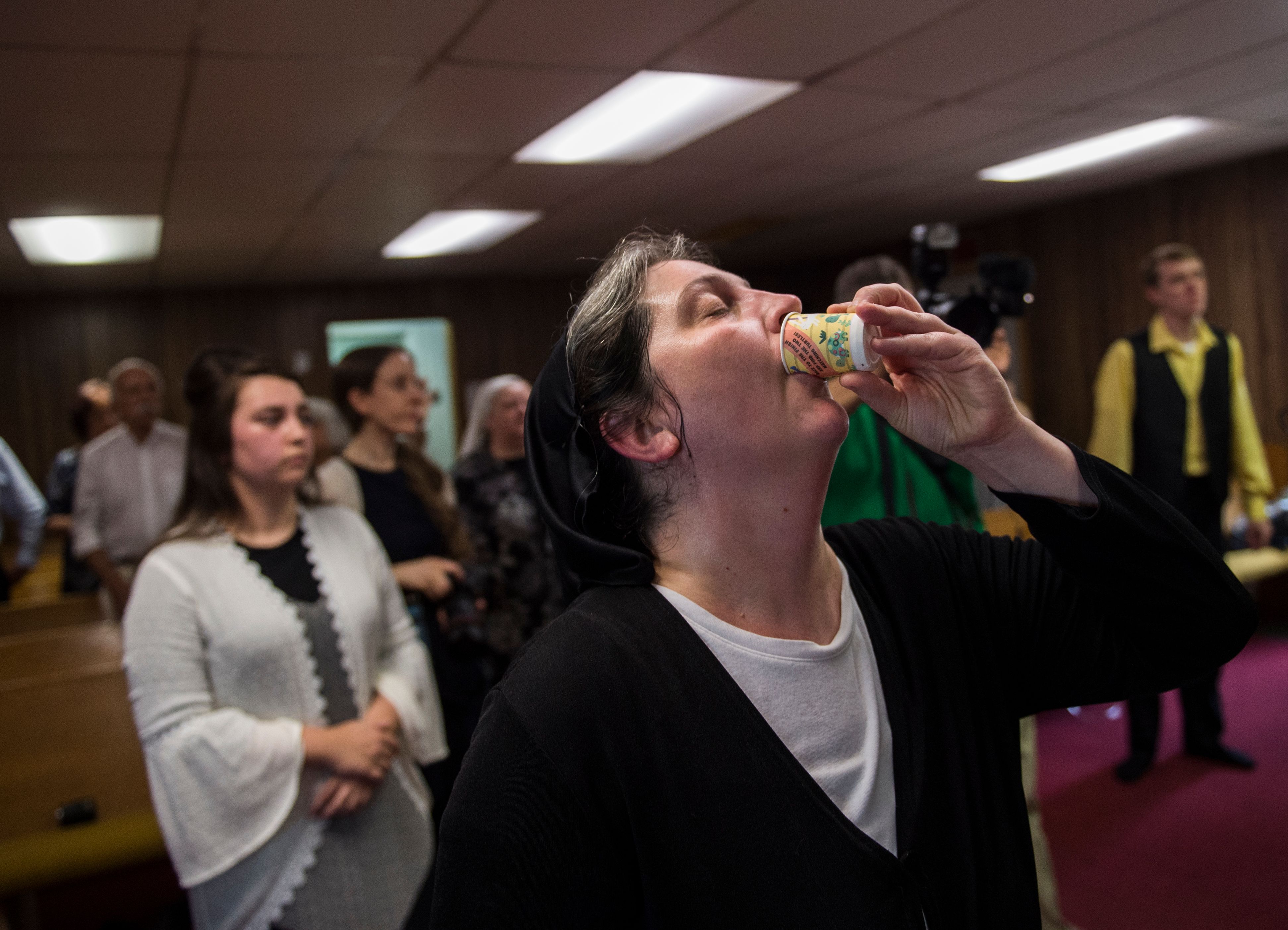 Robin Brandon drinks strychnine during a Pentecostal serpent handlers service at the House of the Lord Jesus church. ACR_0691 copy.jpg
