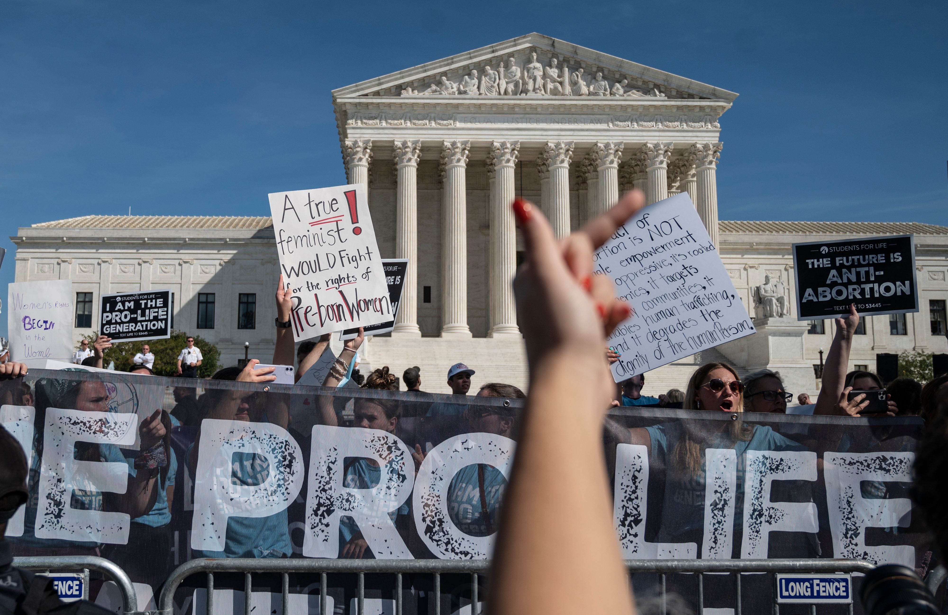 Pro-Life activists counter-protest the Women's March and Rally for Abortion Justice at the US Supreme Court in Washington, DC, on October 2, 2021. 9NZ3PQ.jpg
